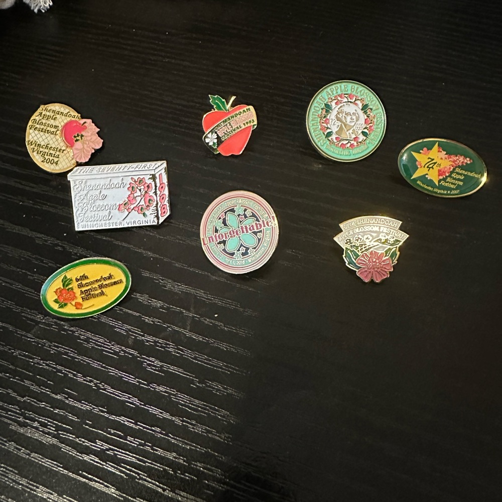 Shenandoah Apple Blossom Festival annual pins. Assorted years.
